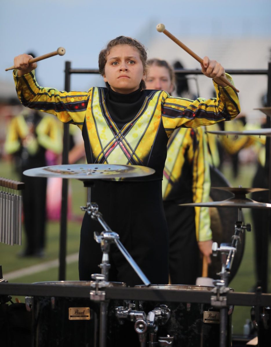 The drumline performs before the start of the varsity football game against Manor on Friday, Sept. 29.