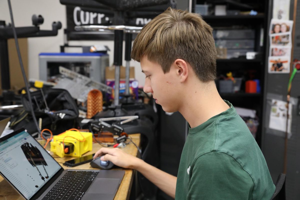 Using Computer Aided Design software, Junior Matthieu Peeters mocks up his team's robot before ordering the materials necessary to construct it. 