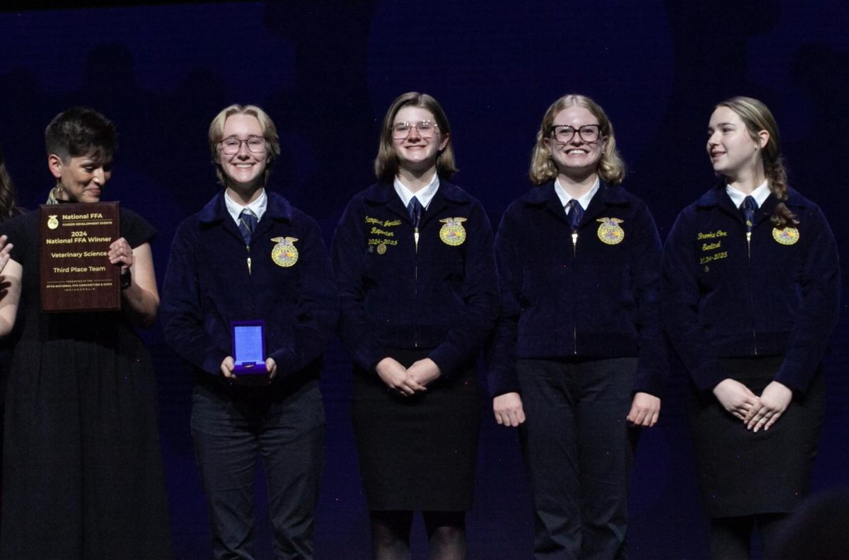 The team accepts their placement award at the National FFA Convention.