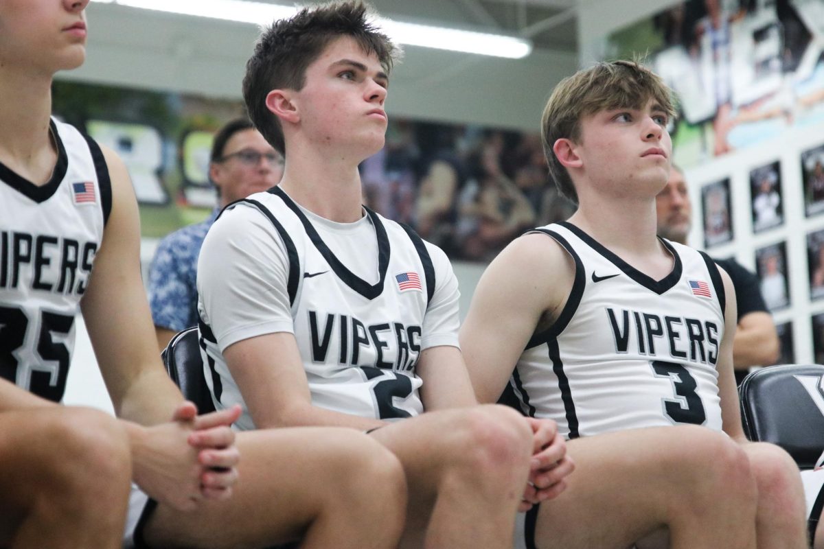 The varsity boys basketball team listens to Head Coach Jaime Sierra prior to the last home game of the season - a district win over Westwood to ensure a playoff spot.